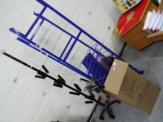 Two sets of blue coloured retail racking and shelving with a quantity of wall mountable racking,