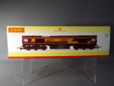 Hornby - an OO gauge diesel locomotive EWS Co-Co class 66 'James Nightall GC' op no 66079,