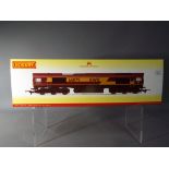 Hornby - an OO gauge diesel locomotive EWS Co-Co class 66 'James Nightall GC' op no 66079,