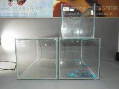 Three glass display cases, the largest approximately 26 cm x 46 cm x 25 cm.