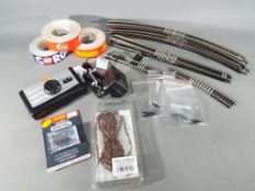 A small quantity of Hornby 2-rail OO gauge track, a Hornby controller,