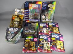 Kenner, Just Toys - A mixed lot of Star Wars related action figures, cups and confectionery.