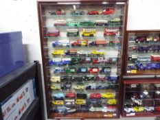 A large, good quality, wall mountable display case with eleven shelves,