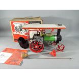 Mamod - a Mamod traction engine with original box and with related ephemera.