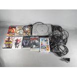 A Sony Playstation games console and a collection of Sony PSP games to include Killzone :