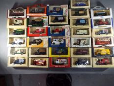 Lledo - a collection of 31 Lledo various model cars to include BP Brox Fireworks, Mobil Oil,