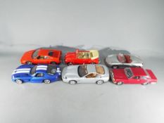 Six unboxed diecast model motor vehicles to include Maisto, Bburago / Burago and Mira.
