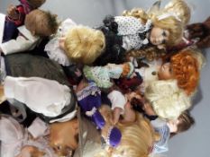Dolls - a large quantity of modern dressed dolls with some stands,
