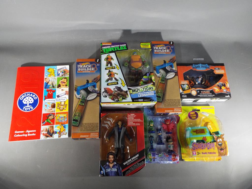 A mixed lot of toys in factory sealed boxes to include 2 x Hot Wheels Track Building System,