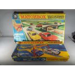Matchbox - a boxed Matchbox motorised motorway M-2 and a Matchbox Superfast SF-5 double track race
