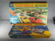 Matchbox - a boxed Matchbox motorised motorway M-2 and a Matchbox Superfast SF-5 double track race