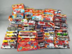 Majorette - In excess of 60 boxed / carded diecast model vehicles by Majorette in various scales.