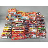 Majorette - In excess of 60 boxed / carded diecast model vehicles by Majorette in various scales.