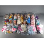 Barbie - ten dressed Barbie dolls and a quantity of Barbie clothes and accessories