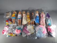 Barbie - ten dressed Barbie dolls and a quantity of Barbie clothes and accessories