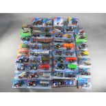 Siku - Approximately 38 diecast carded and boxed diecast model vehicles by Siku in various scales