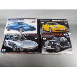 Tamiya Japan - four Tamiya Japan 1/24 Sports Car Series model cars to include Mitsubishi Lancer