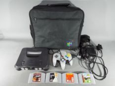 Nintendo - A Nintendo N64 games console and controller,