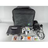 Nintendo - A Nintendo N64 games console and controller,