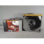 Corgi - Two James Bond diecast sets by Corgi comprising # CC99106 The Definitive Bond Film Canister