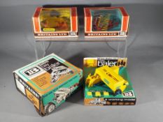 Britains - Three boxed model Farm implements by Britains.
