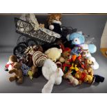 A collection of over 20 soft toys including TY Beanies and similar with a dolls pram and doll.