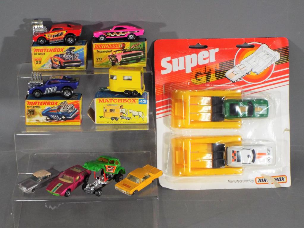 Matchbox - A collection of 9 predominately boxed / carded Matchbox diecast model vehicles.
