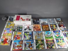 Nintendo - A boxed Nintendo DSi hand held games console and a quantity of games,