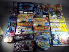 A mixed lot to include four Pokemon magazines 2019 with factory sealed free gifts in blister packs,