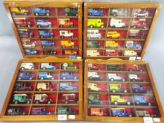 Four display cases each containing fifteen diecast vehicles.