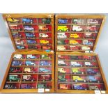 Four display cases each containing fifteen diecast vehicles.