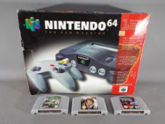 Nintendo - A boxed Nintendo N64 games console with controller and three game cartridges comprising