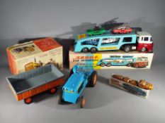 Tomiyama and others - Three boxed vintage Japanese and Chinese tinplate toys.