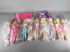 Barbie - ten dressed Barbie dolls and two Barbie shoe sets by Mattel #14800,