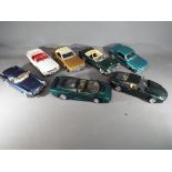 Mira, Maisto, Guitoy - seven 1/18 scale model cars, unboxed to include Jaguar, Aston Martin,