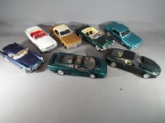 Mira, Maisto, Guitoy - seven 1/18 scale model cars, unboxed to include Jaguar, Aston Martin,