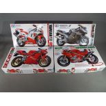 Tamiya model kits - four Tamiya model kits of motorbikes to include Yamaha YZF-R1,