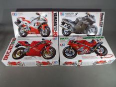 Tamiya model kits - four Tamiya model kits of motorbikes to include Yamaha YZF-R1,