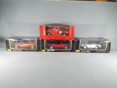 Four 1:18 scale diecast model motor vehicles to include three Maisto comprising Dodge Concept