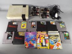 Nintendo - A Nintendo NES games console with four controllers and twelve games cartridges including