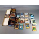 A tin containing a quantity of trading cards to include Magic the Gathering, Yu-Gi-Oh!, X-Men,