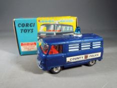 Corgi Toys - A boxed 464 Commer Police Van.