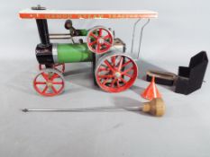 Mamod - an unboxed Mamod Steam Tractor with steering rod, spirit burner and filling funnel.