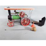 Mamod - an unboxed Mamod Steam Tractor with steering rod, spirit burner and filling funnel.