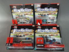 Micro Machines - four mint blister packs of Hasbro Micro Machines racing sets to include 1,