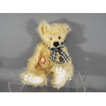 Charlie Bear - a Charlie Bear entitled Olly HCB079998 with ribbon,