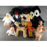 A mixed lot to include two black dolls, Felix the cat, two soft toys by Gilroy,