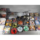 Playstation - Two Sony Playstation games consoles, two controllers and approximately 36 boxed games.