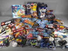 Lego - 24 packets of sealed Lego various codes to include DC Superheroes, Nexo Knights, Star Wars,