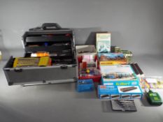An aluminium case and box containing a quantity of modelling / crafting equipment,